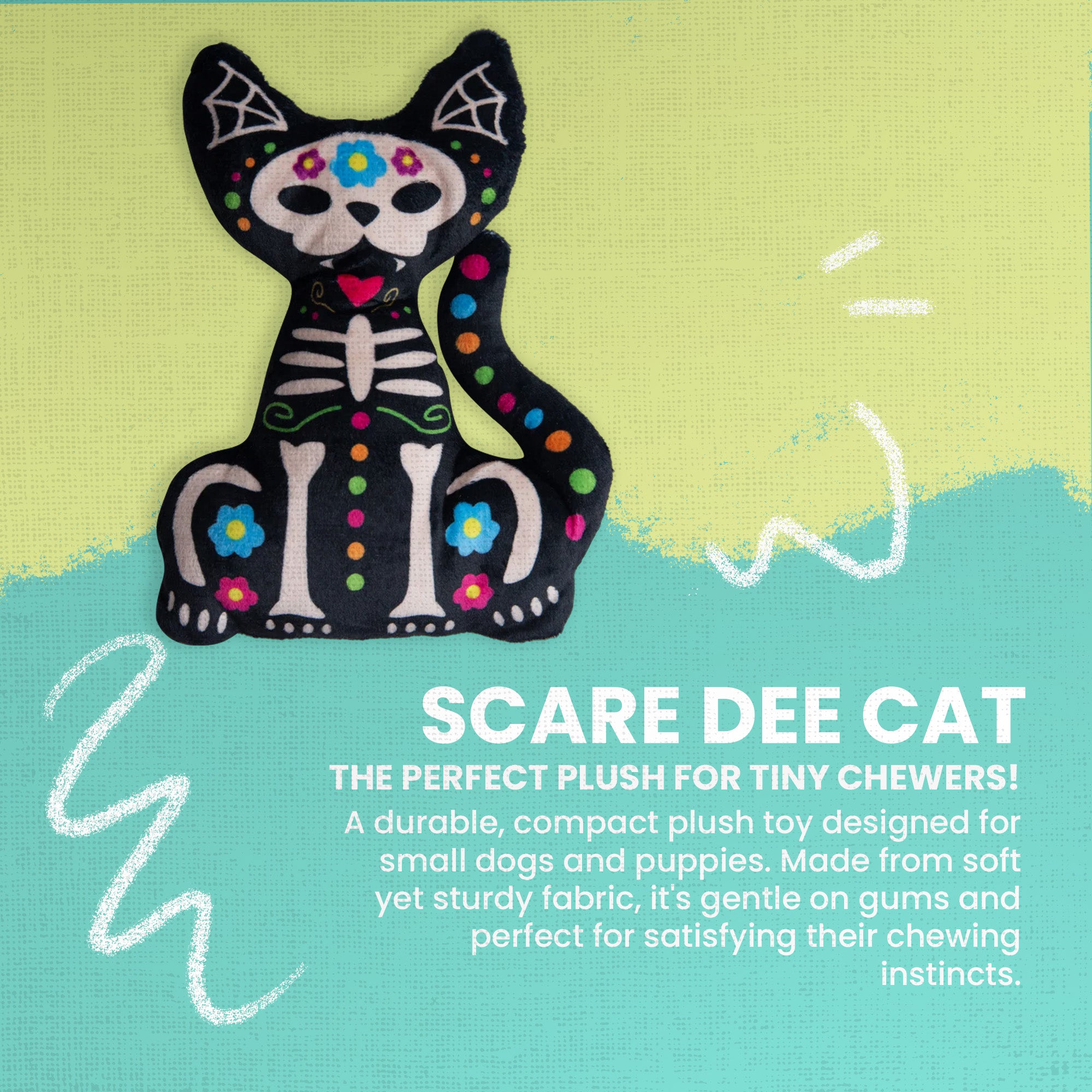 The Snugarooz Scare Dee Cat is an eco-friendly dog toy shaped like a cat with a Day of the Dead sugar skull theme, featuring colorful flowers, polka dots, bones, and spiderwebs on black—perfect for Halloween.