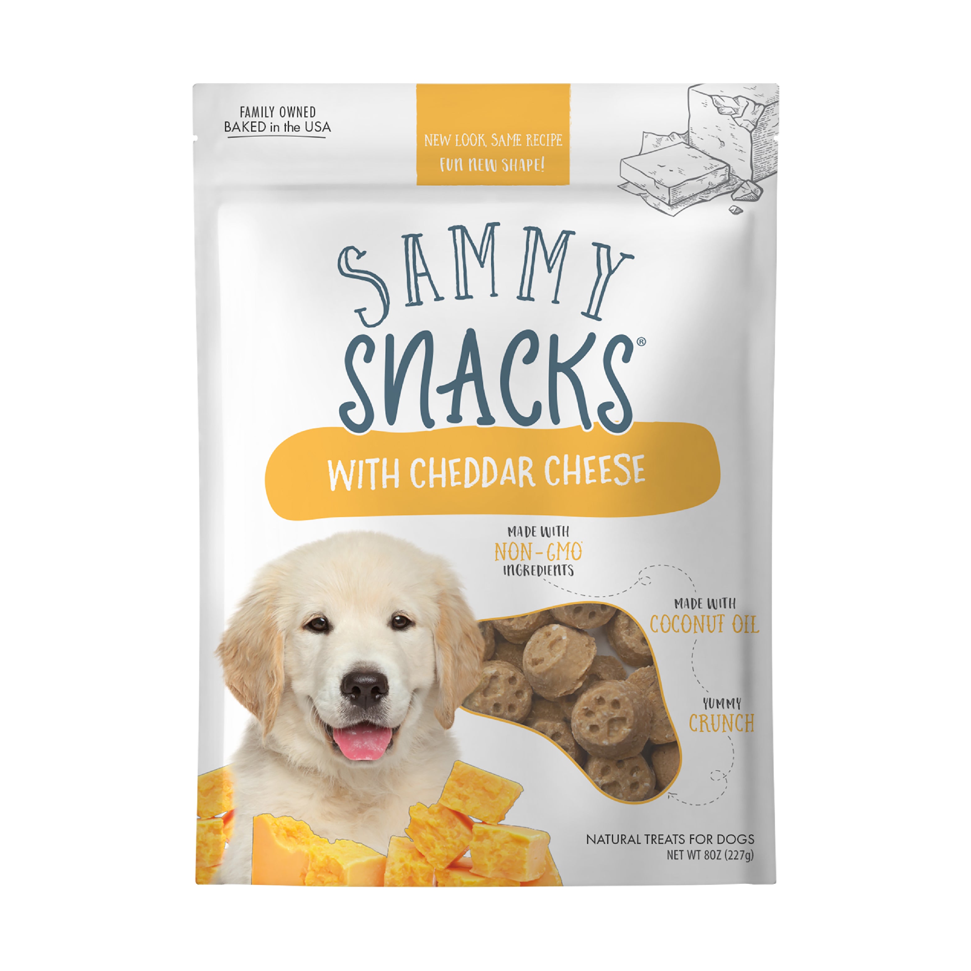 Ancestry Sammy Snacks With Cheddar Cheese are healthy dog treats made with non-GMO ingredients, coconut oil, and Vitamin C. The packaging features a golden retriever puppy and cheddar cheese pieces.