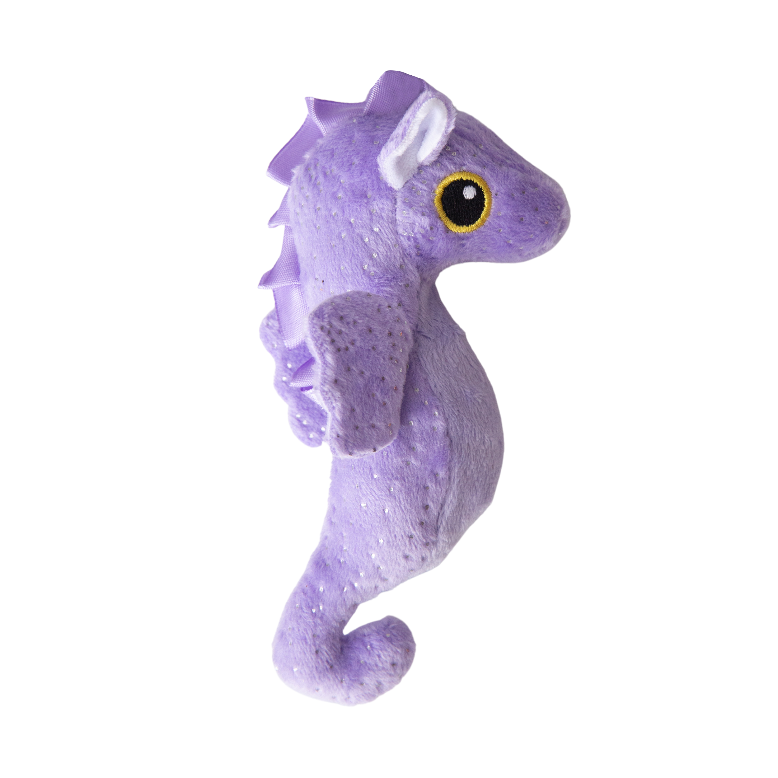 The Snugarooz Baby Shelly is a plush purple seahorse dog toy with sparkly wings, a ridged back, and a large yellow-and-black eye, shown from the side against a white background.