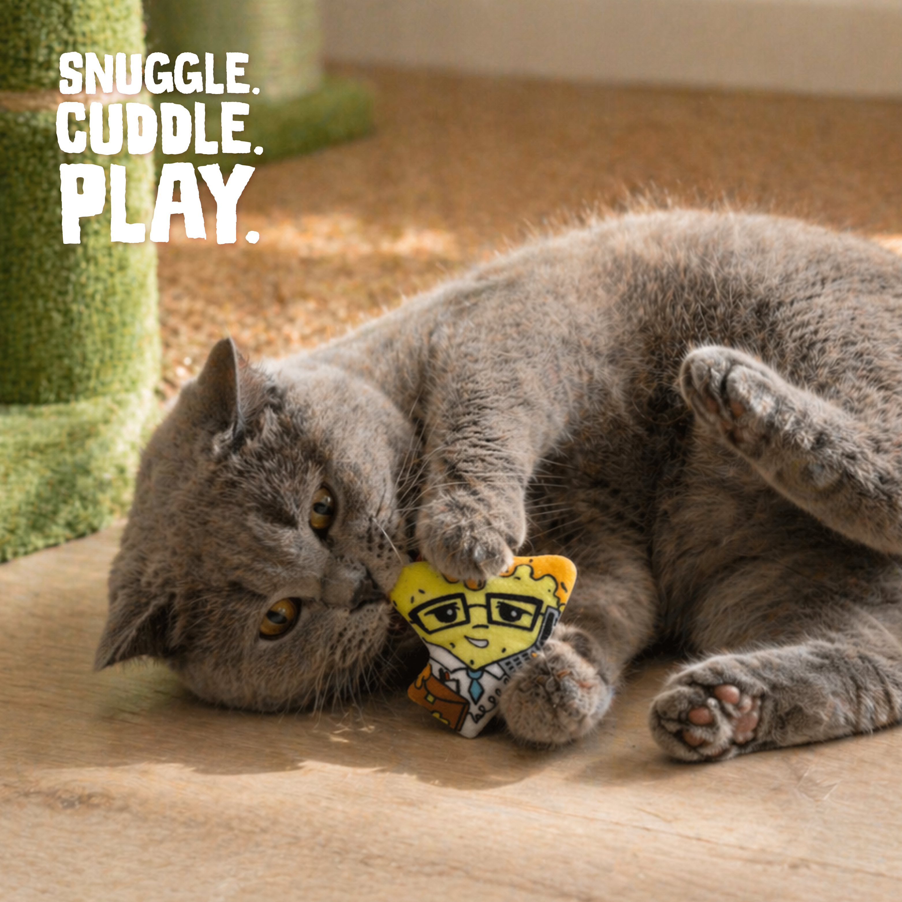 The Snugarooz Nacho Man with Catnip is a cute, eco-friendly plush cat toy shaped like a studious pizza slice—complete with glasses and a notepad—perfect as a fun catnip treat for your playful feline.