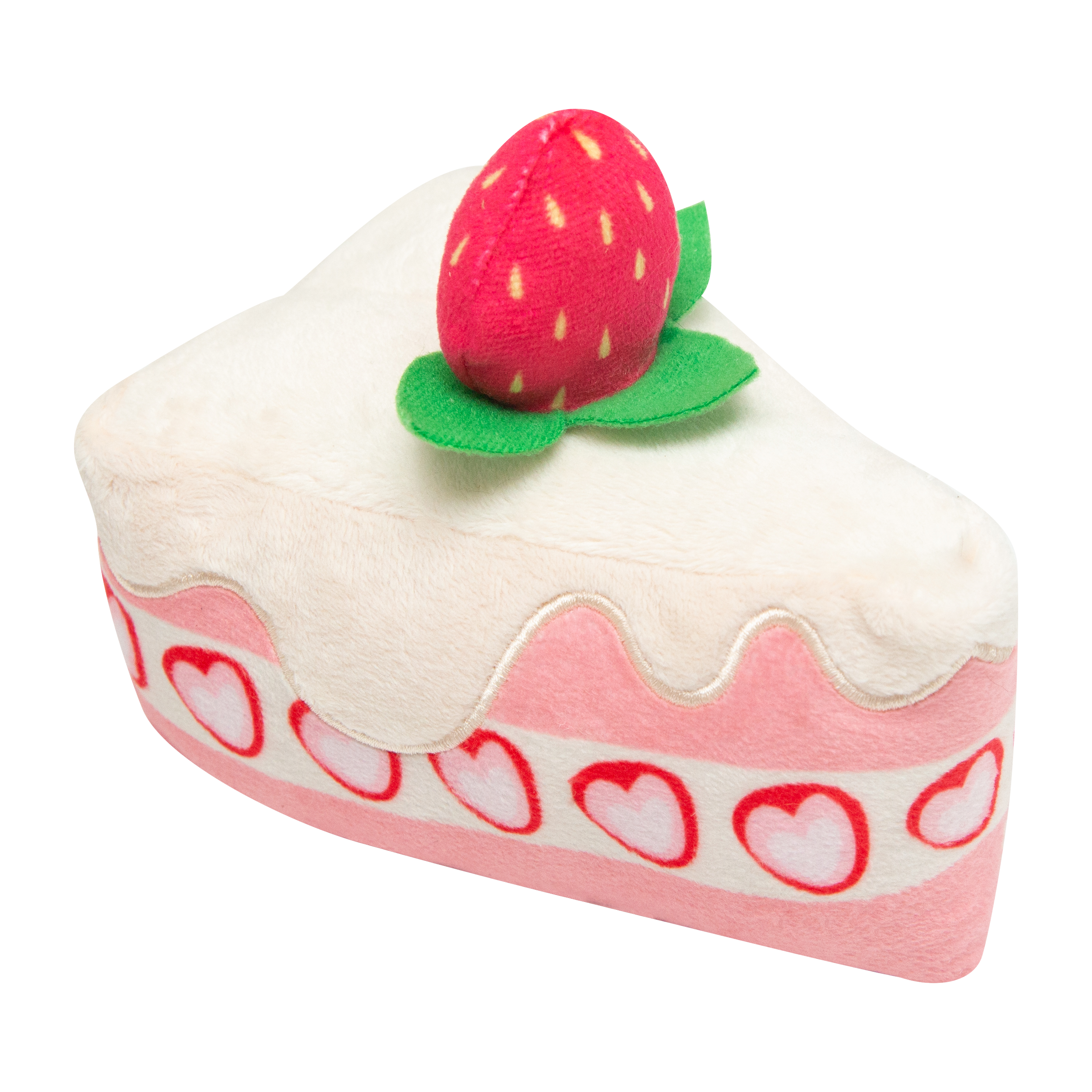 The Snugarooz Piece of Cake is a plush dog toy shaped like a cake slice with white icing, pink layers, heart decorations, and a strawberry on top—a delightful treat for your furry friend.