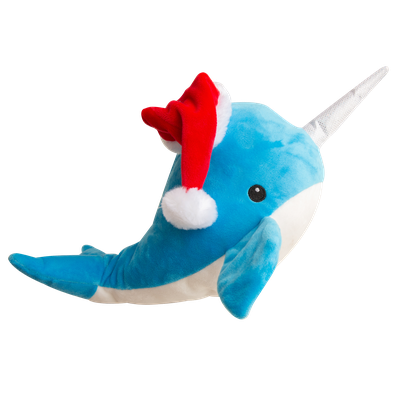 The Snugarooz St. Nikki is a blue and white plush narwhal dog toy with a red and white Santa hat and soft gray horn, shown against a plain white background.