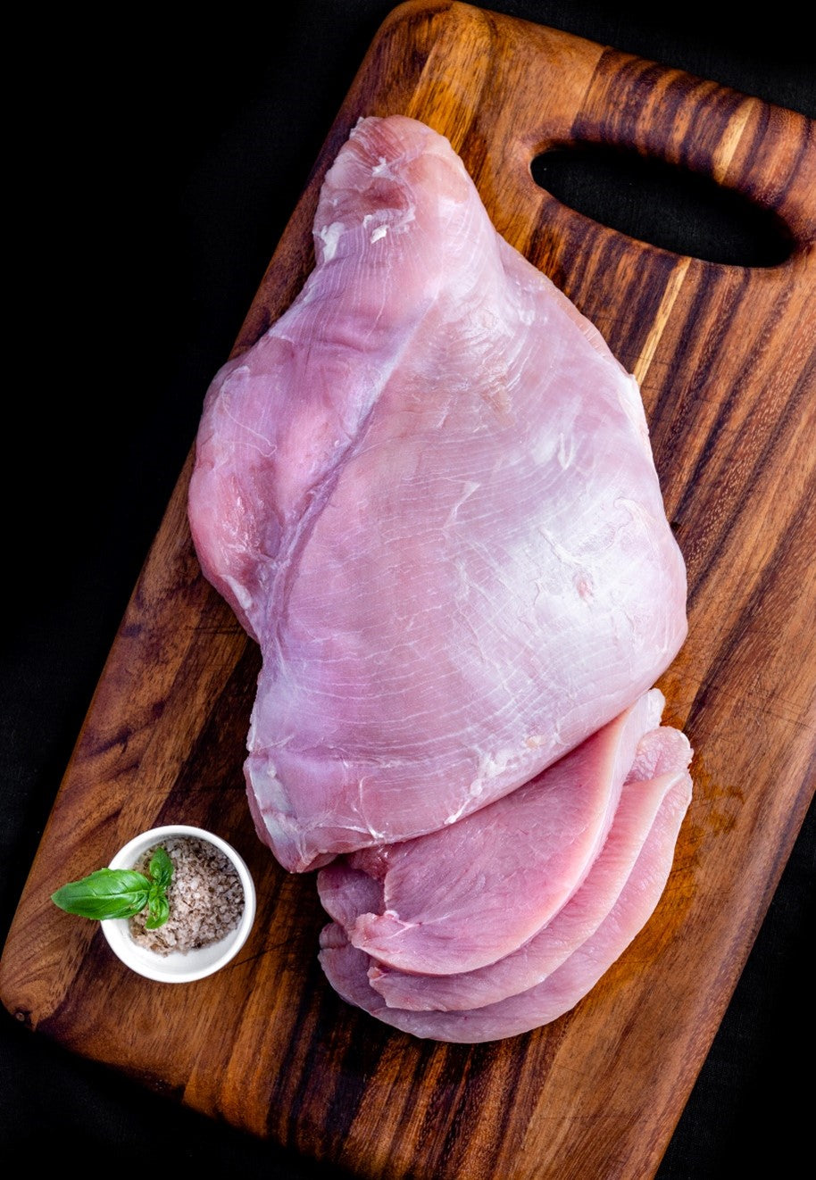 deboned chicken on cutting board