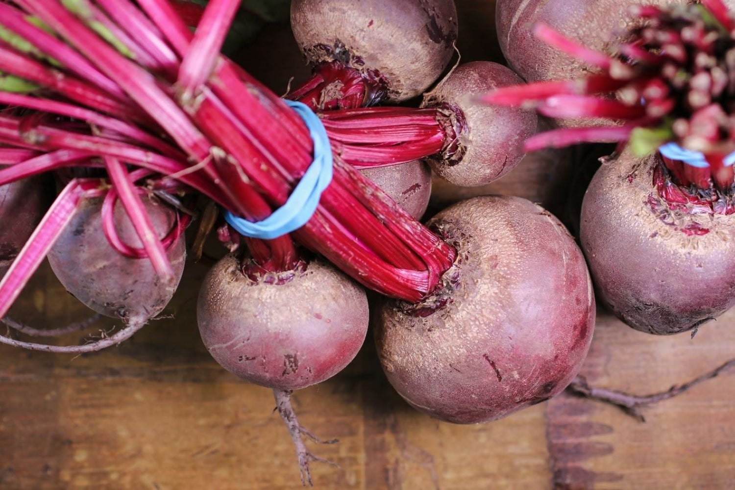 raw beets bundled on the table
