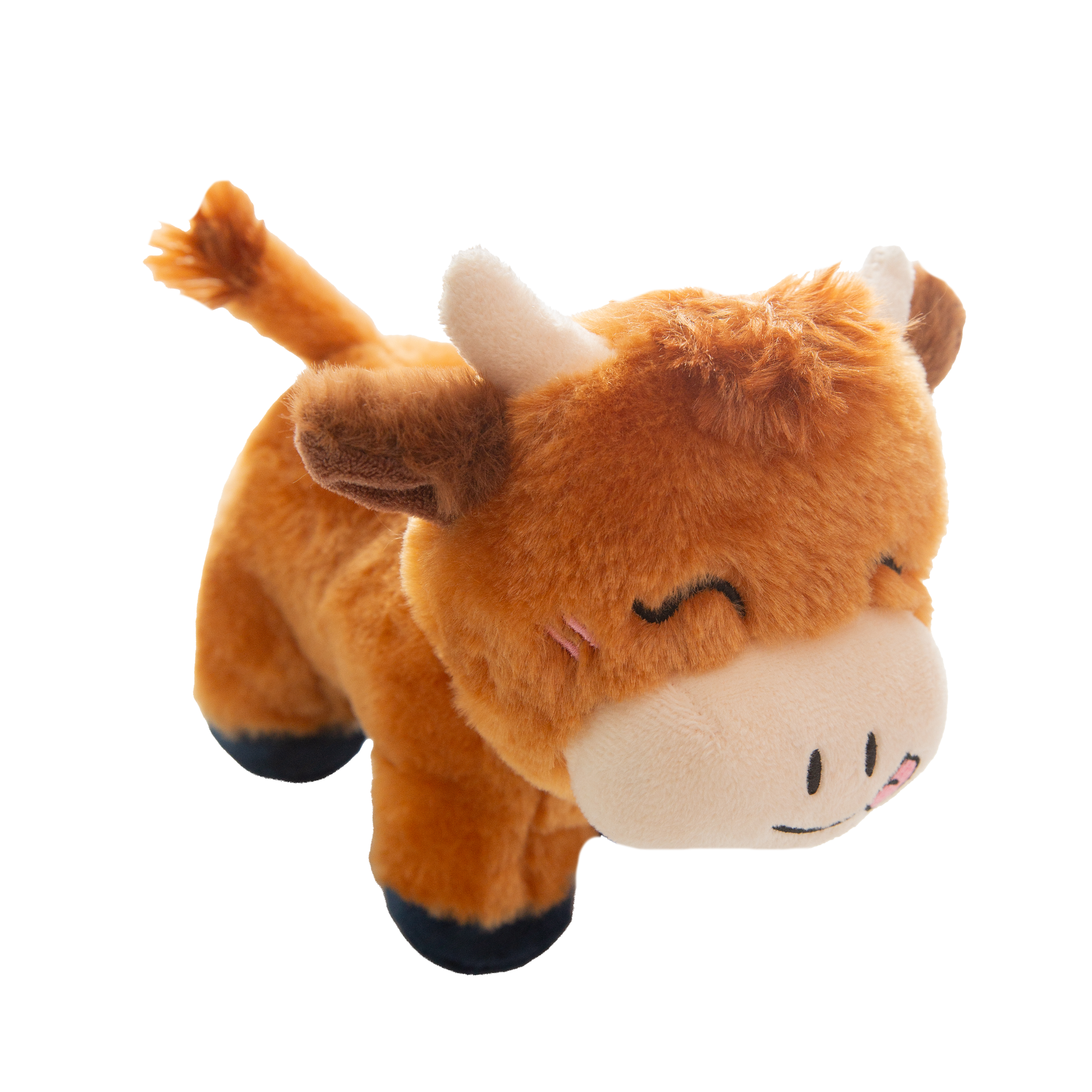 Howdy the Highland by Snugarooz is a cute, brown Highland cow dog toy with closed eyes, a happy smile, its tongue out, small white horns, and dark hooves—perfect for cuddling and playtime fun.