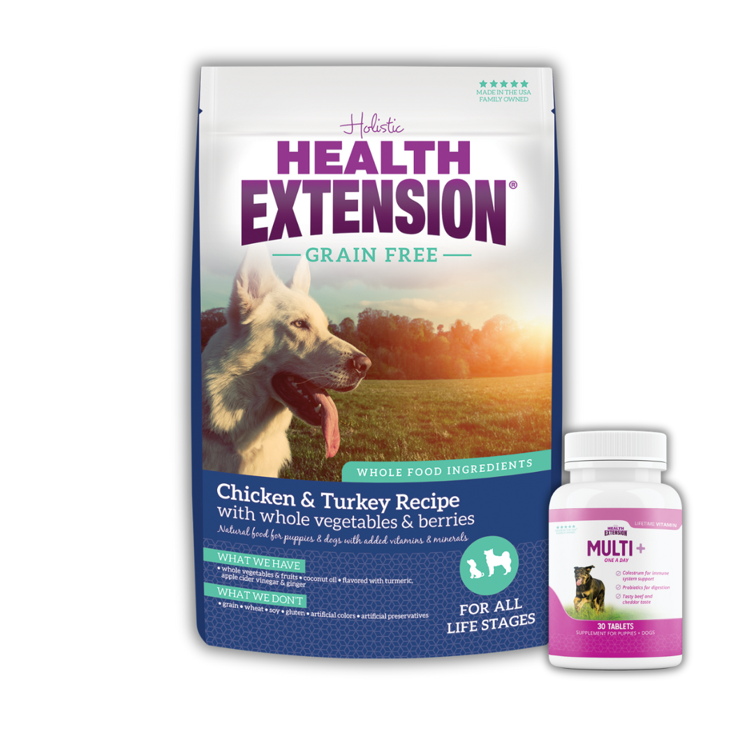 Health Extension Grain-Free Chicken & Turkey Recipe dog food bag with a white dog image, and a bottle of Multi+ dog vitamins.